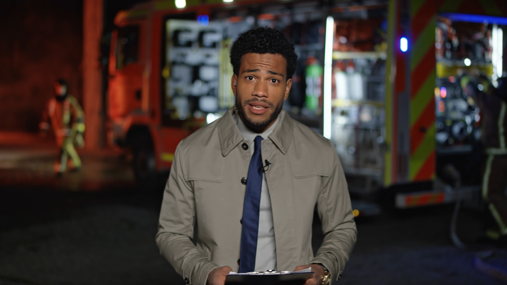 Reporter working at an active scene