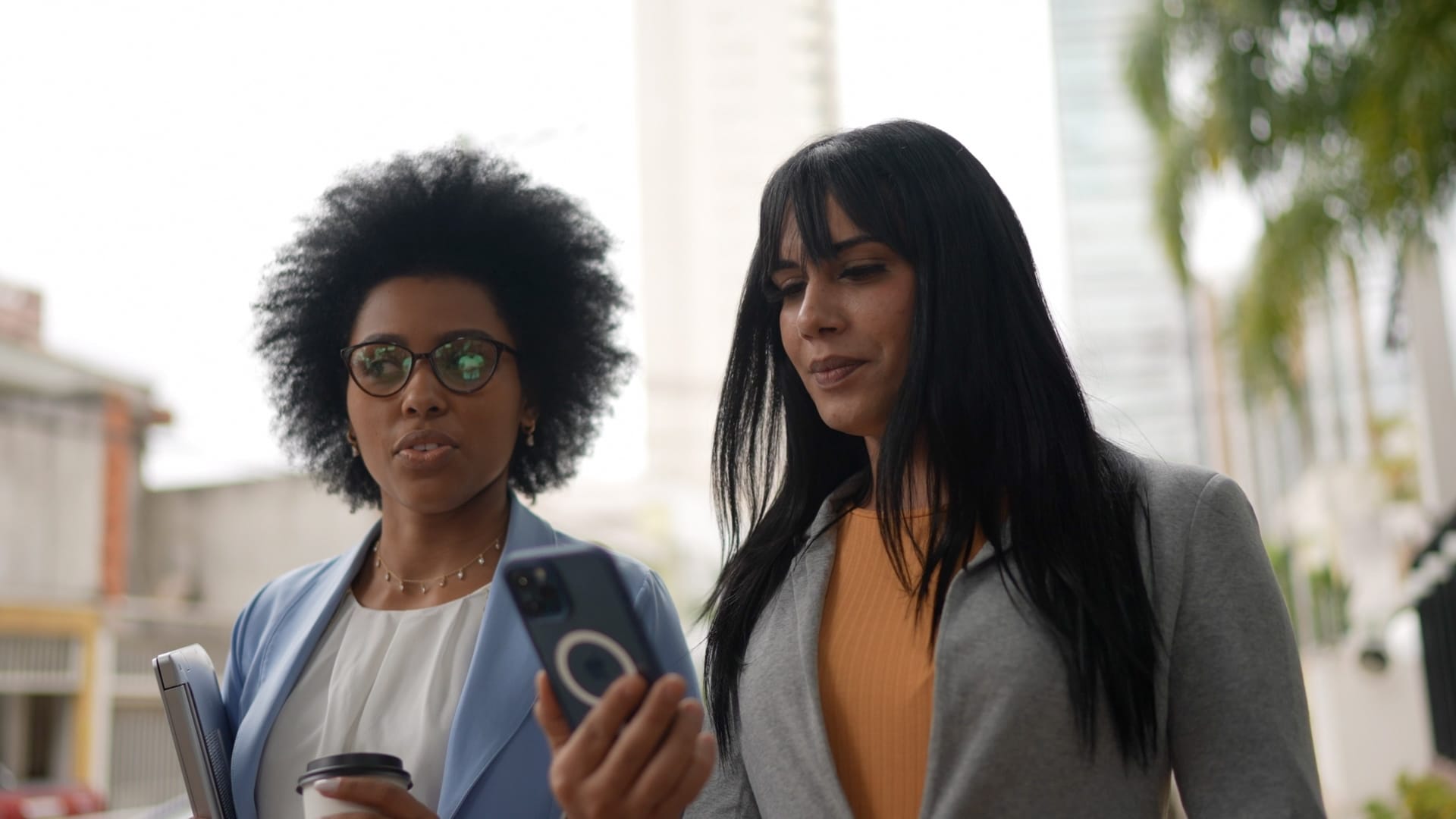 Two female media sale reps walking